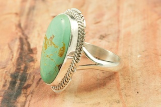 Genuine Manassa Turquoise set in Sterling Silver Ring. This Turquoise is also referred to as King�s Manassa Turquoise. The Manassa Turquoise mine is located in Manassa, Conejos County, Colorado. Created by Navajo Artist Larson Lee. Signed by the artist.